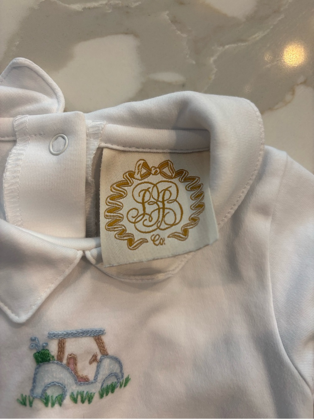 White Baby Polo Romper with Blue Trim and Tractor Embroidery - Picture 3 of 3